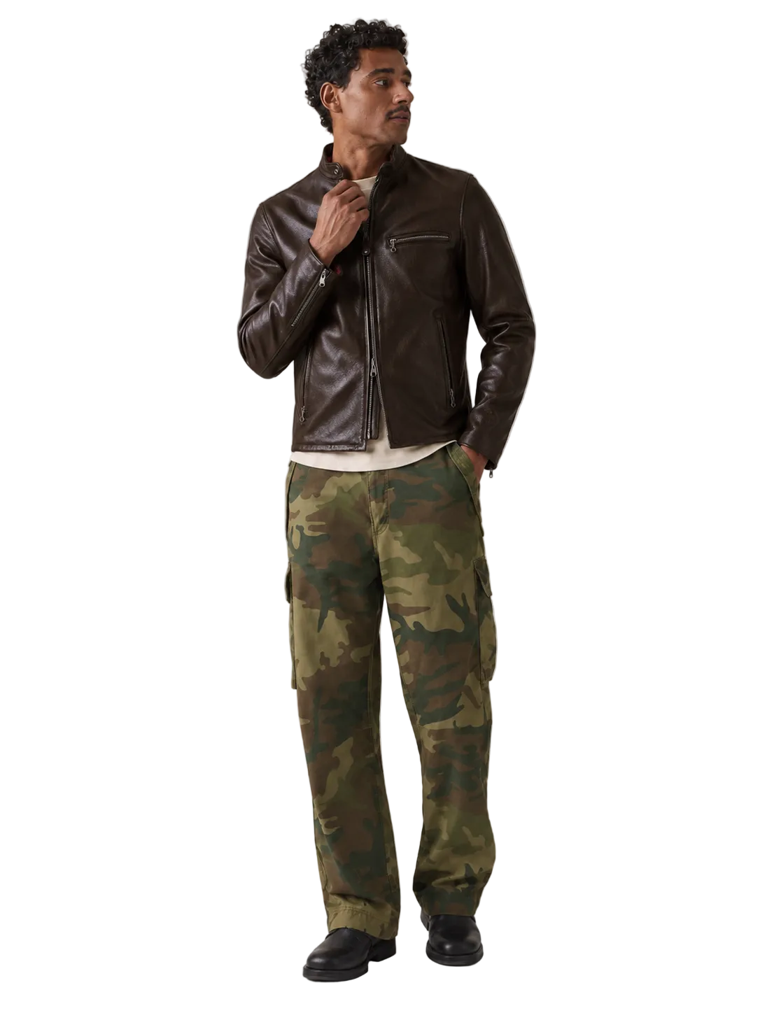Man wearing brown leather jacket and camouflage cargo pants for stylish outdoor look
