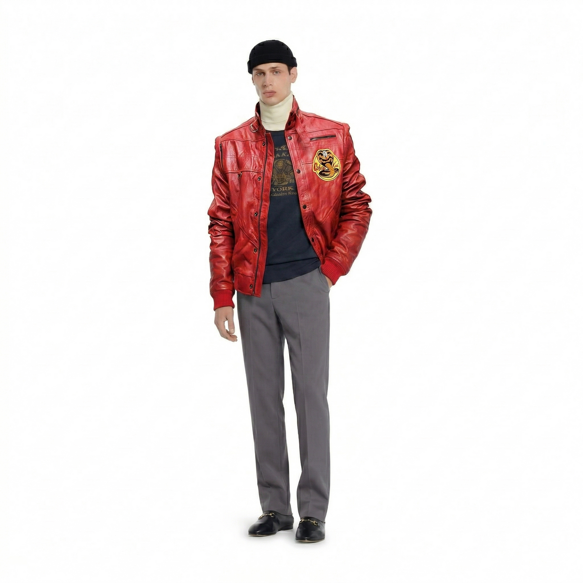Red leather bomber jacket with Cobra Kai patch, worn with turtleneck, gray pants, and black beanie