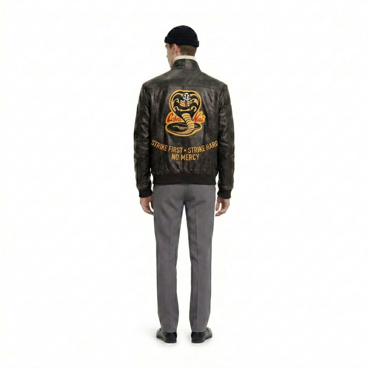 Men's leather jacket with Cobra Kai logo and 'Strike First, Strike Hard, No Mercy' text on back