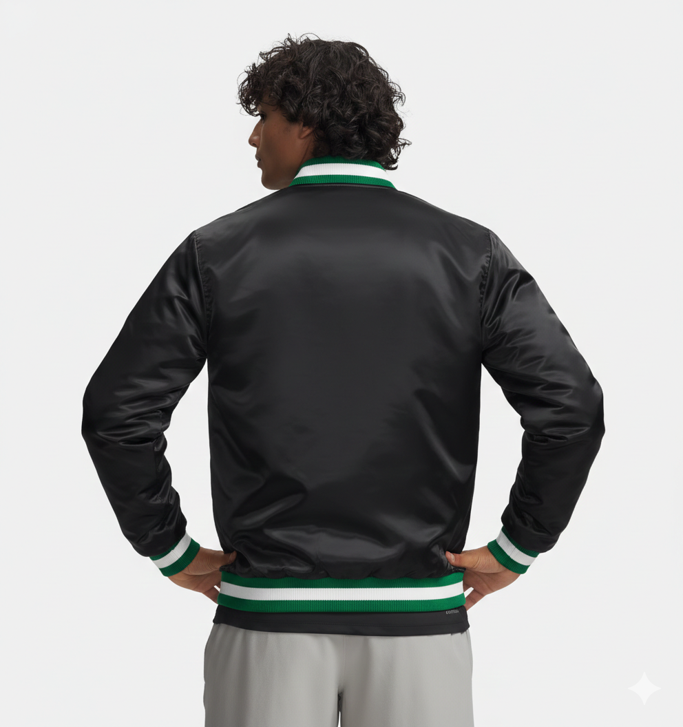 Black satin bomber jacket with green and white ribbed trim, worn by man with hands on hips