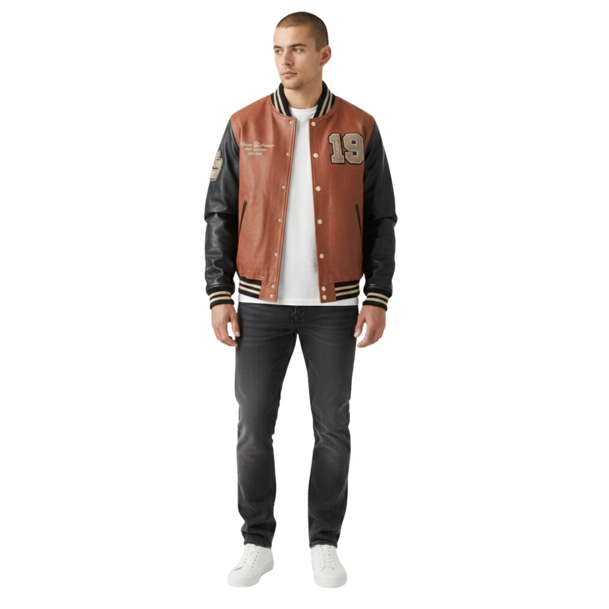 Men's brown and black varsity jacket with number 19, worn with white tee and dark jeans