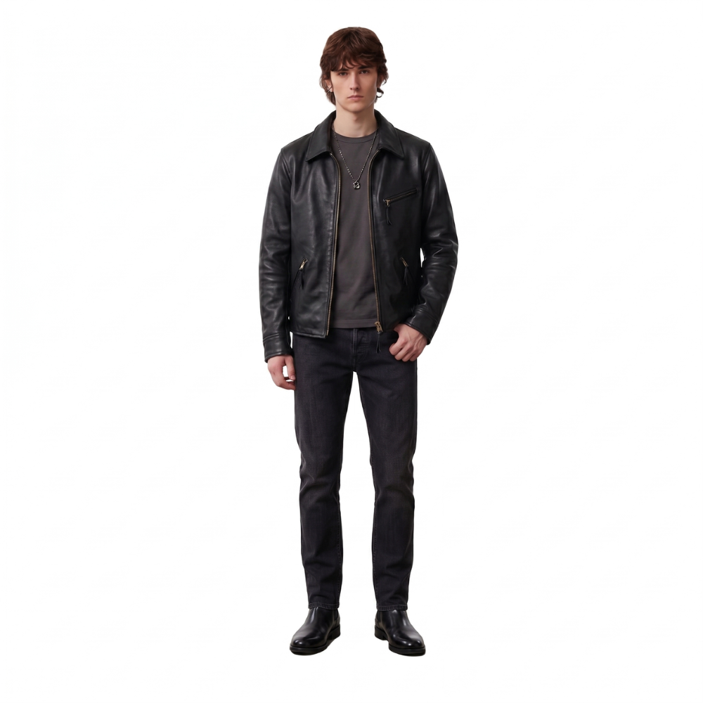 Men's black leather jacket with zipper details, styled with dark jeans and boots for a casual look