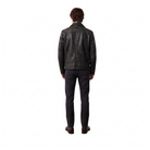 Man wearing black leather jacket and dark jeans, back view