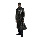 Man in sleek black leather trench coat with belt, holding matching bag, stylish urban look