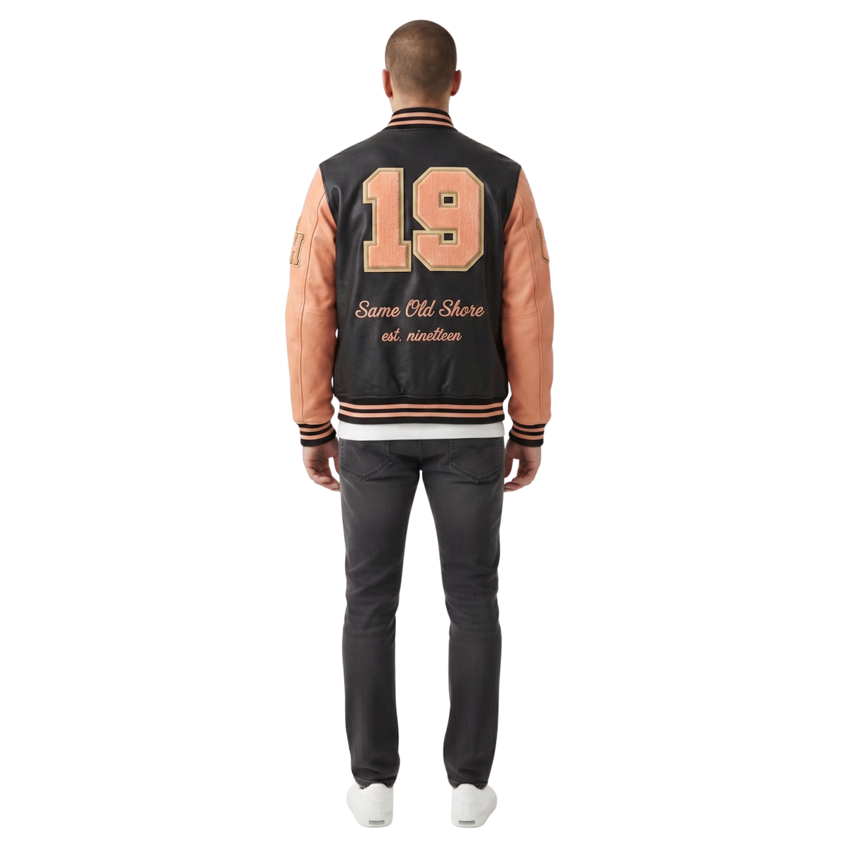 Men's varsity jacket with '19 Same Old Shore' back print, black body, peach sleeves, striped cuffs
