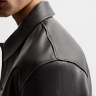 Black leather shirt with collar and shoulder stitching detail