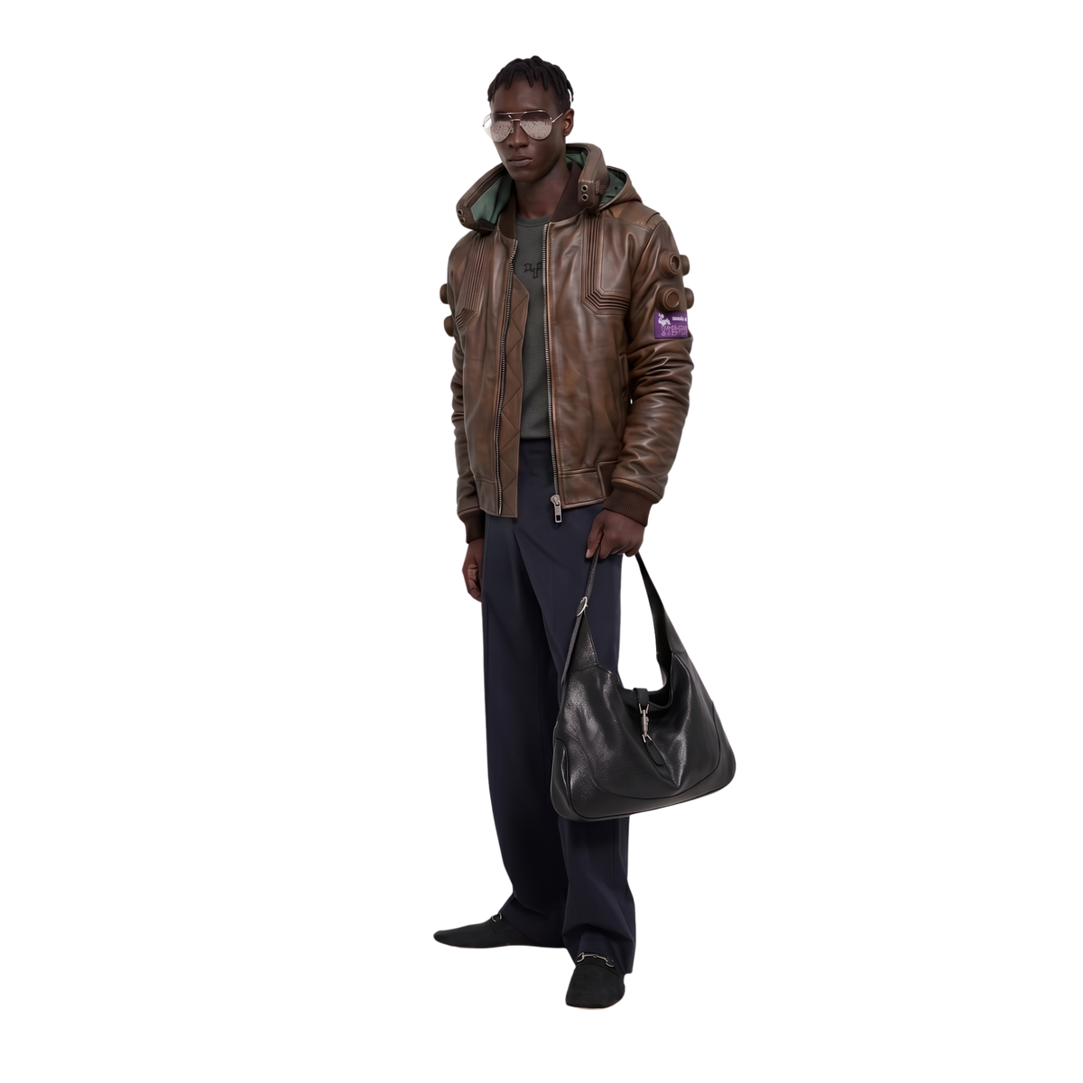 Man wearing brown leather bomber jacket, dark pants, and carrying black shoulder bag
