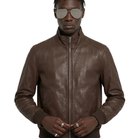 Brown leather bomber jacket with zipper and ribbed cuffs, styled with aviator sunglasses