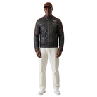 Men's black leather jacket with N7 logo, red accents, and zippered pockets, styled with white pants and cap