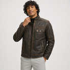 Men's distressed brown leather jacket with zip pockets and quilted shoulders, styled casual