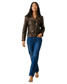 Woman in brown leather moto jacket with belt, blue jeans, and heels