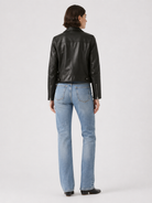 Black leather jacket with blue jeans, back view, stylish casual outfit