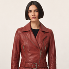 Women's red leather biker jacket with belt and zippers
