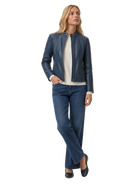 Woman wearing navy blue leather jacket with ribbed sweater and wide-leg jeans, stylish casual outfit