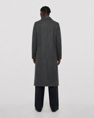 Men's charcoal gray textured overcoat with notched lapel, back view, paired with dark trousers