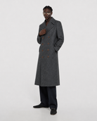 Men's gray double-breasted long coat with patterned wool blend, styled with dark trousers and loafers