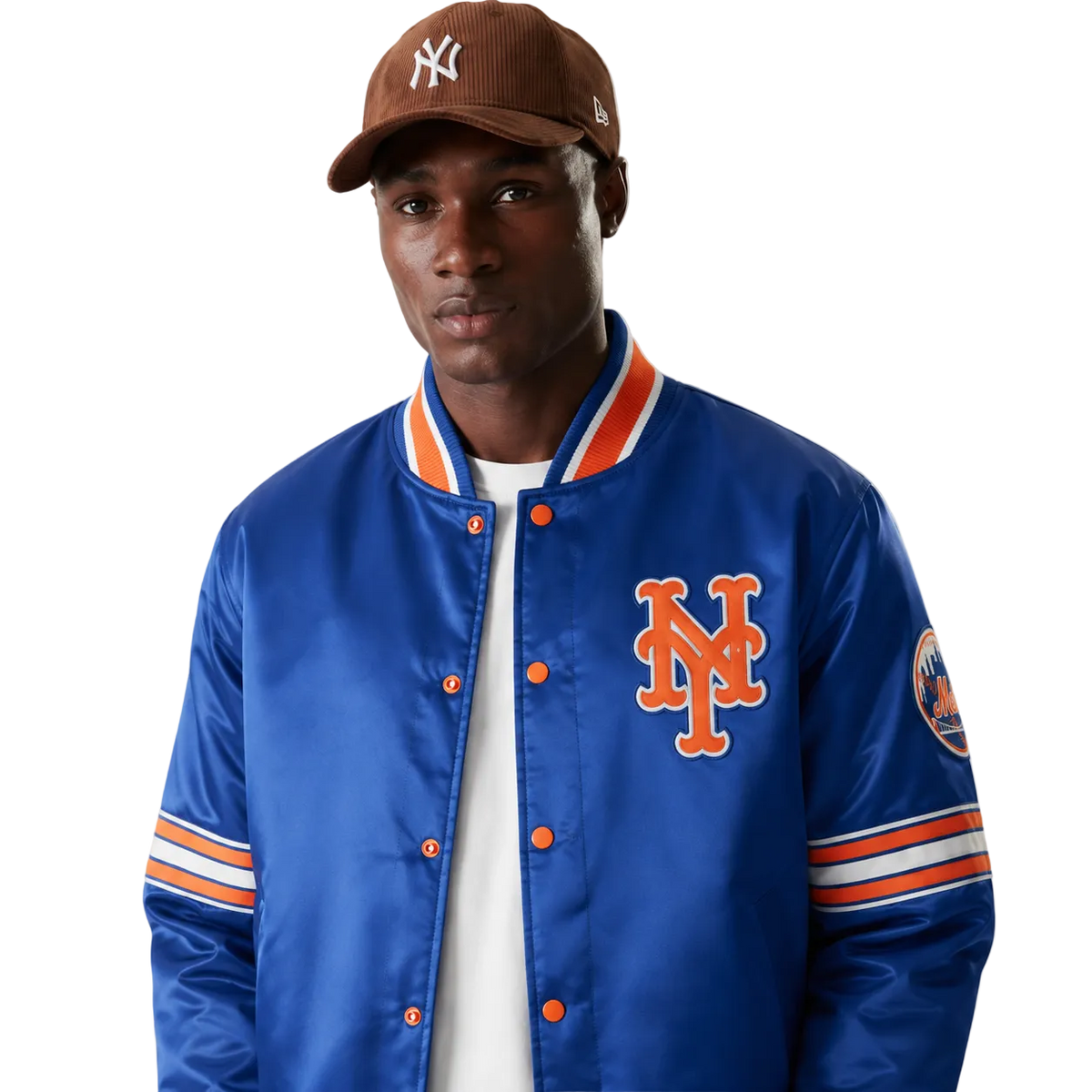 Blue New York Mets satin varsity jacket with orange logo and striped sleeves, worn with brown cap