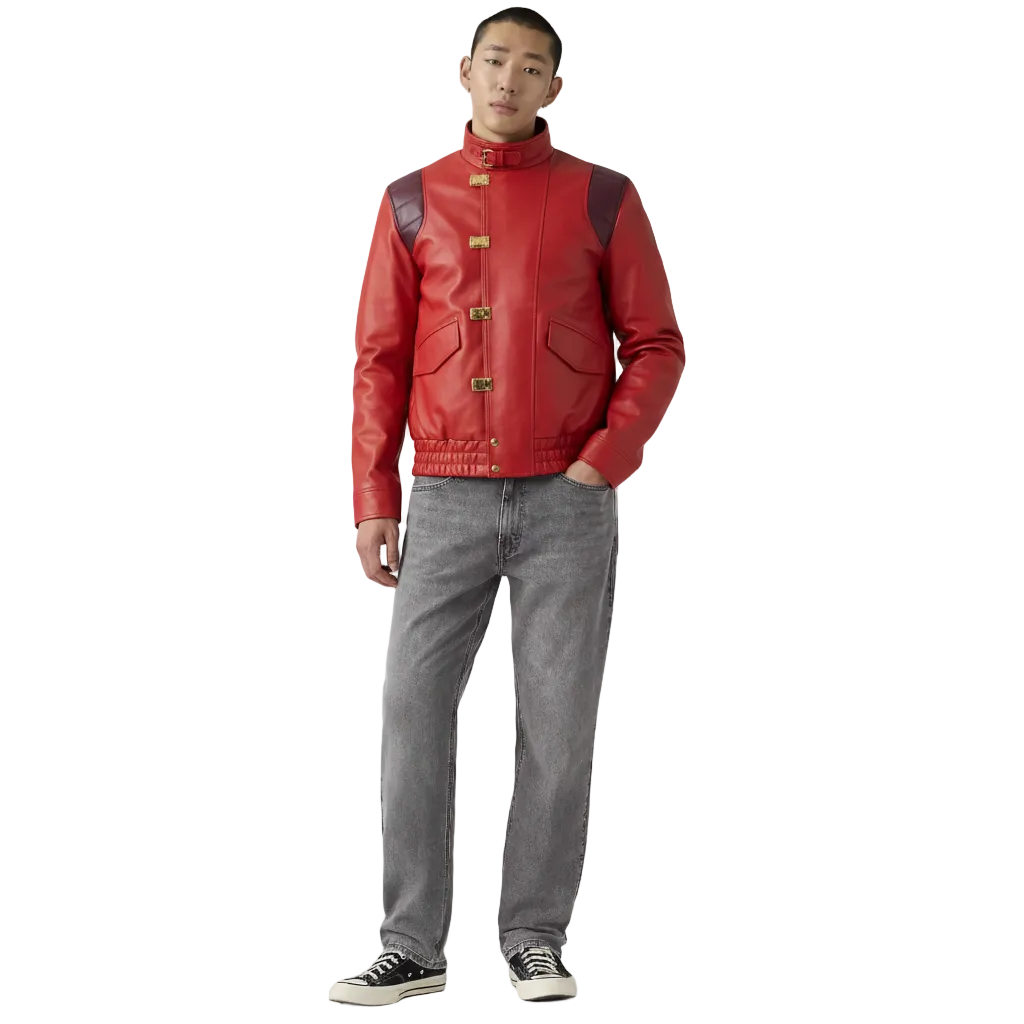 Man wearing red leather jacket with gold buckles, gray jeans, and black sneakers