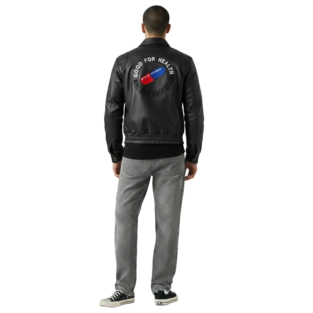 Men's black leather jacket with 'Good for Health' graphic back patch, paired with gray jeans and sneakers