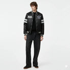 Men's Dallas Cowboys varsity jacket with star logo, black satin bomber style, striped sleeves, casual wear