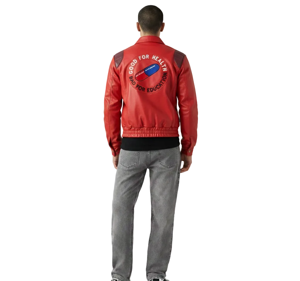 Red leather jacket with 'Good for Health Bad for Education' graphic back design, worn with gray jeans
