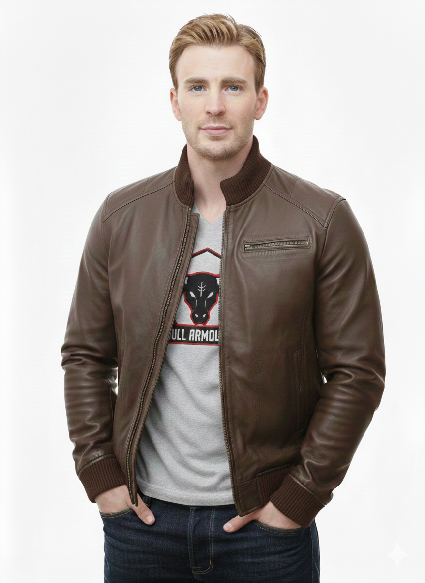 Man wearing brown leather bomber jacket with ribbed collar, zipped front, and chest pocket, paired with graphic tee and jeans