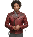 Man wearing red distressed leather biker jacket with zippers and snap buttons, styled with gray sweater