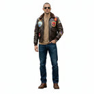Man wearing vintage bomber jacket with patches, aviator sunglasses, jeans, and brown boots
