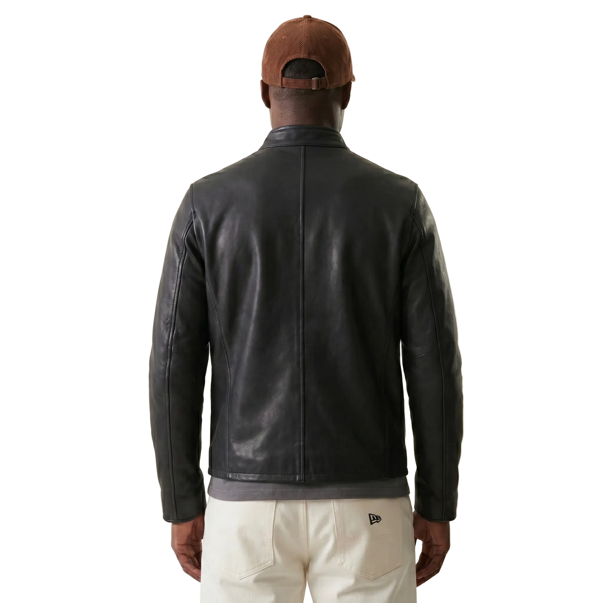 Men's black leather jacket back view with brown cap and cream pants