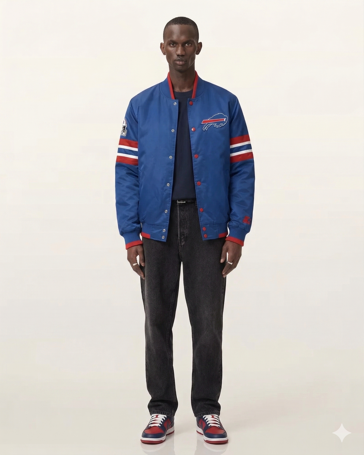 Blue Buffalo Bills varsity jacket with red and white stripes, worn with dark jeans and sneakers