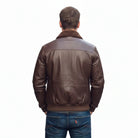 Brown leather bomber jacket with shearling collar, back view on male model