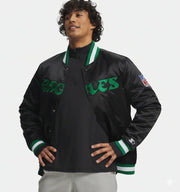 Men's black Eagles varsity jacket with green lettering and NFL patch, featuring ribbed collar and cuffs