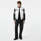 Dallas Cowboys varsity jacket with star logo, black sleeves, and striped accents