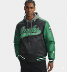 Green and black Eagles varsity jacket with hooded sweatshirt underneath, featuring team logo and striped cuffs.