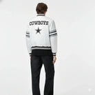 White Cowboys varsity jacket with star logo, black stripes, and black jeans, back view