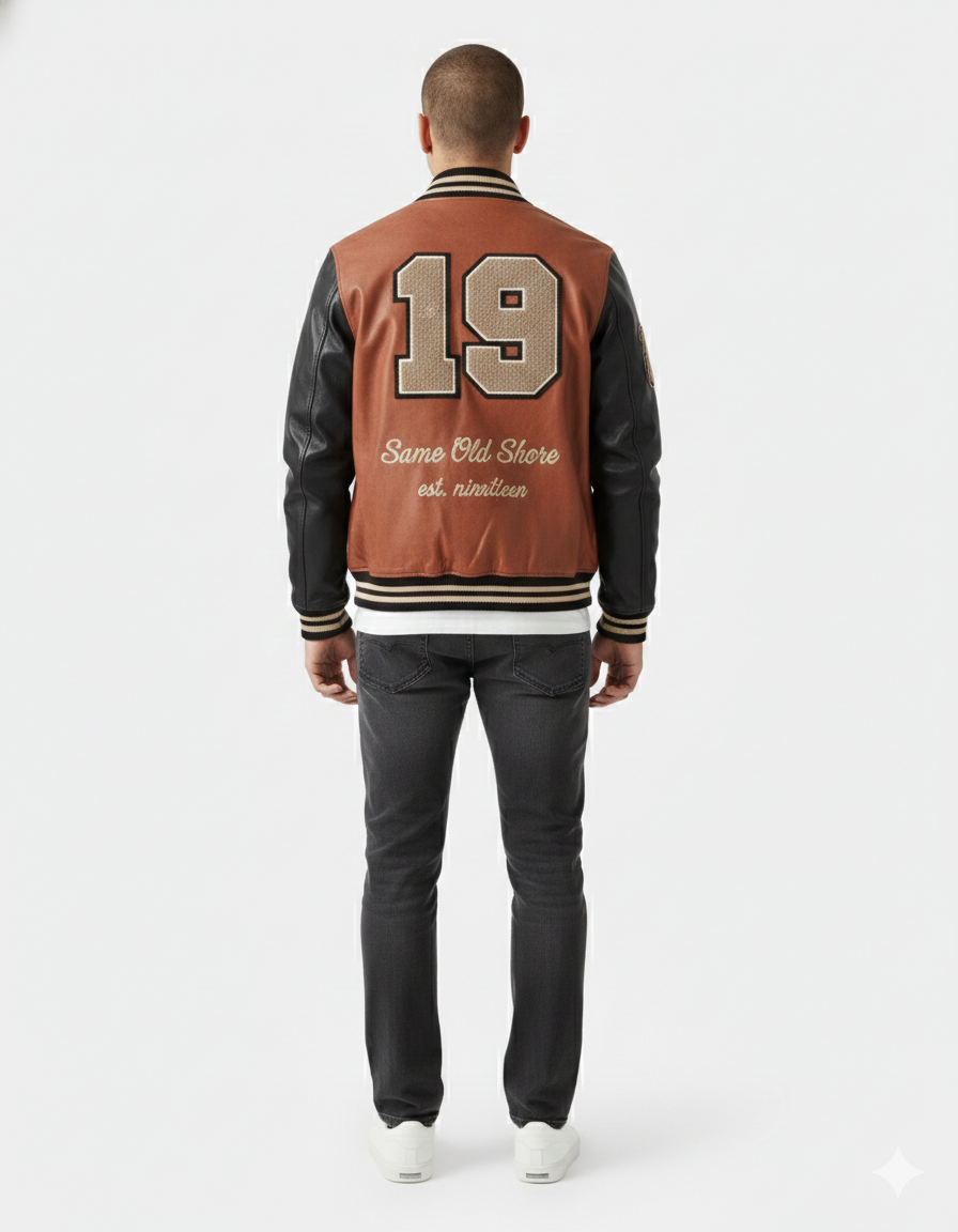 Men's varsity jacket with '19' and 'Same Old Shore' text, brown body, black sleeves, striped trim