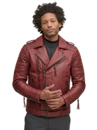 Man wearing burgundy leather biker jacket with quilted shoulders and zippers, styled over gray turtleneck